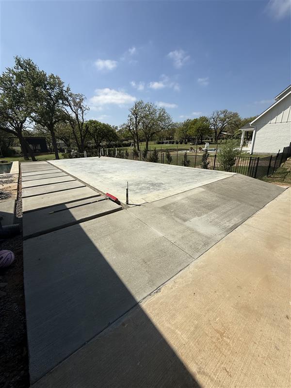 Phase 6 — Finished slab pad ready for the covered structure build-out