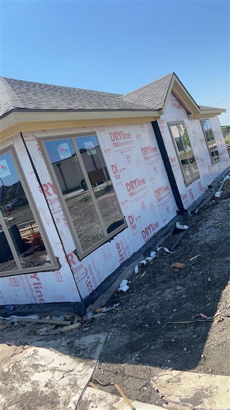 Phase 7 — Framing complete, sheathed and roofed—ready for exterior finish