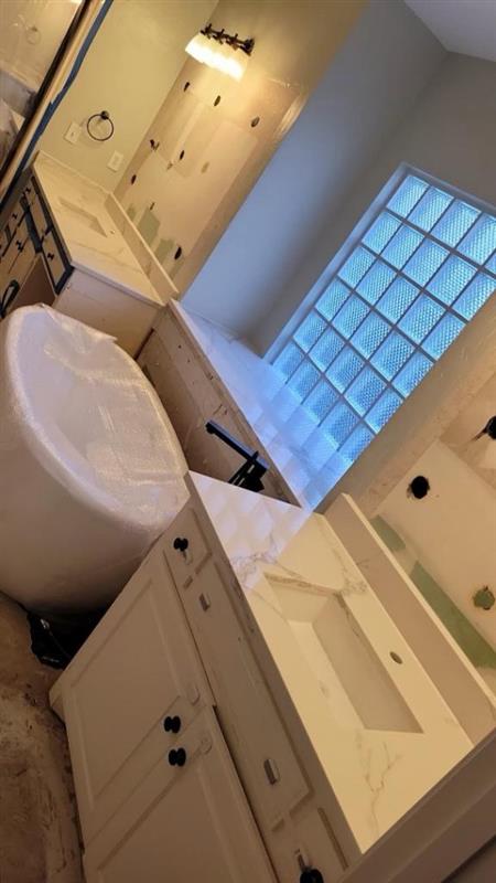 Phase 11 — Primary bath with soaking tub, walk-in shower and dual quartz vanity