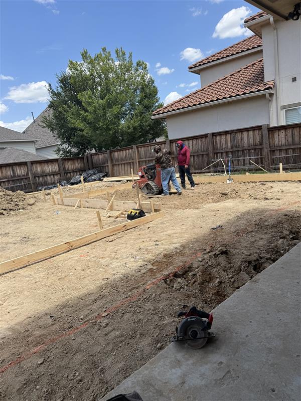 Phase 2 — Site prep and layout with form boards staged for the addition footprint