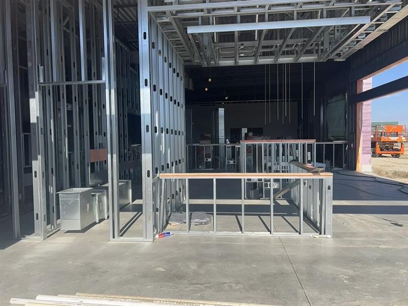 Phase 6 — Interior light-gauge steel wall framing and rough openings inside the building