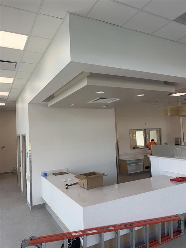 Phase 13 — Drop-soffit reception and back-of-house pass-through with quartz counter installed
