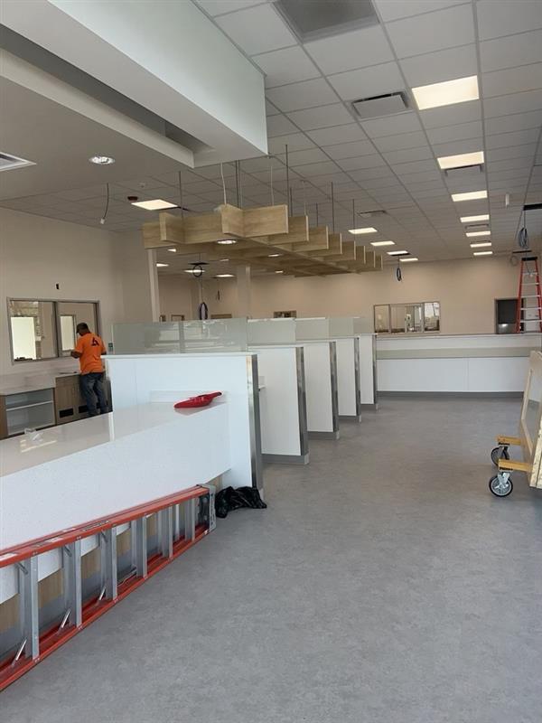Phase 12 — Drywall complete with millwork cubicles and finished ceiling grid taking shape