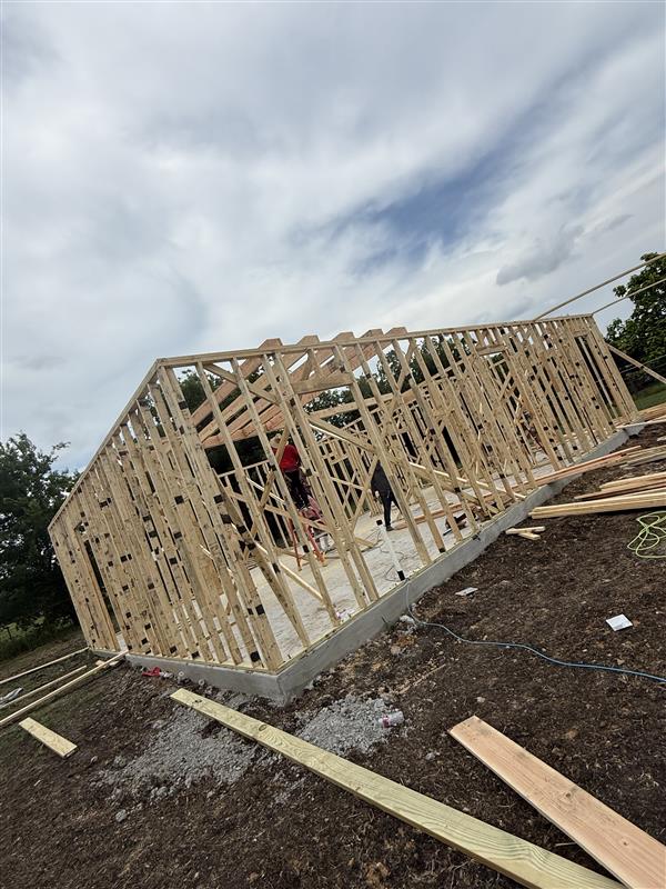 Phase 4 — ZIP System sheathing going up on exterior walls