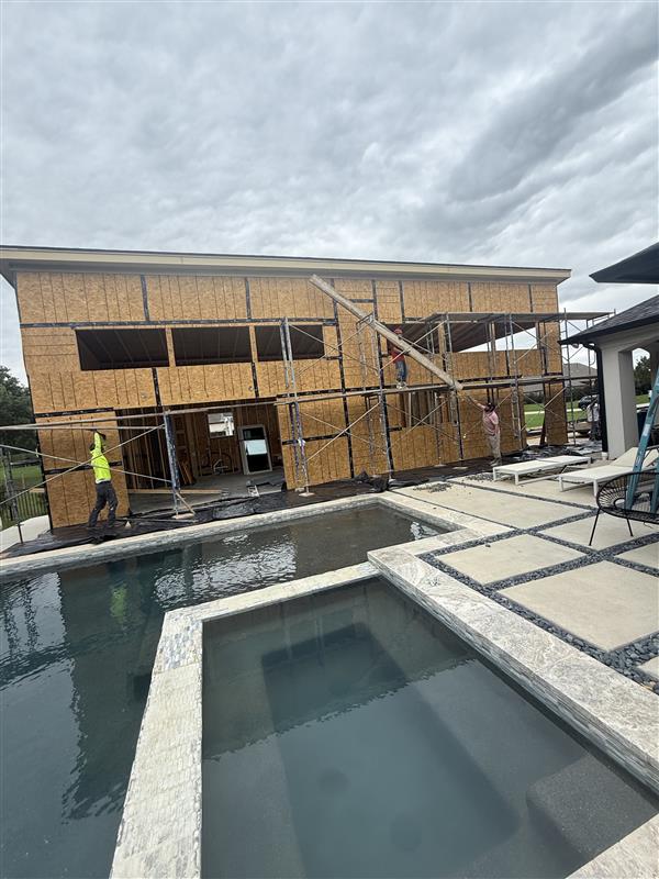 Phase 21 — Rear elevation fully sheathed and dried in, ready for exterior finishes