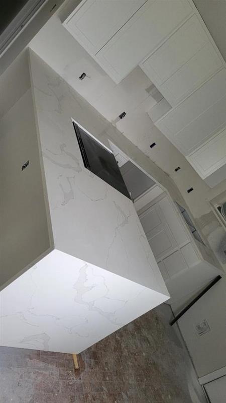 Phase 9 — Interior kitchen with quartz waterfall island installed