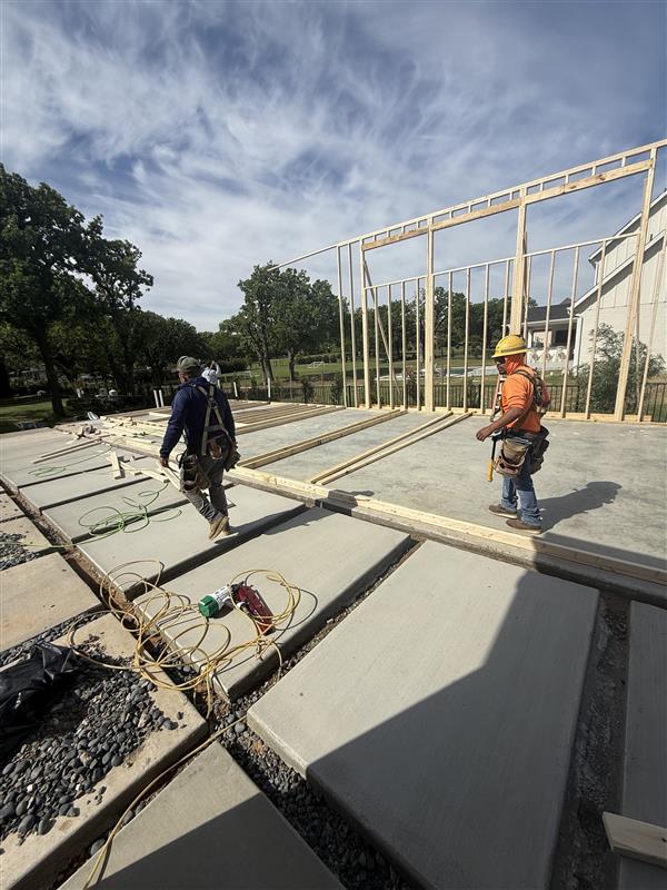 Phase 7 — Wood wall framing going up on the new patio slab