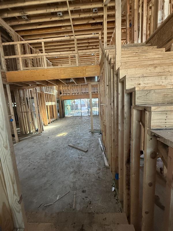 Phase 6 — Interior framing complete through the entry and stair opening