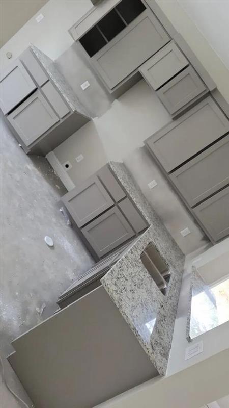 Phase 14 — Kitchen with gray shaker cabinets and granite island countertop